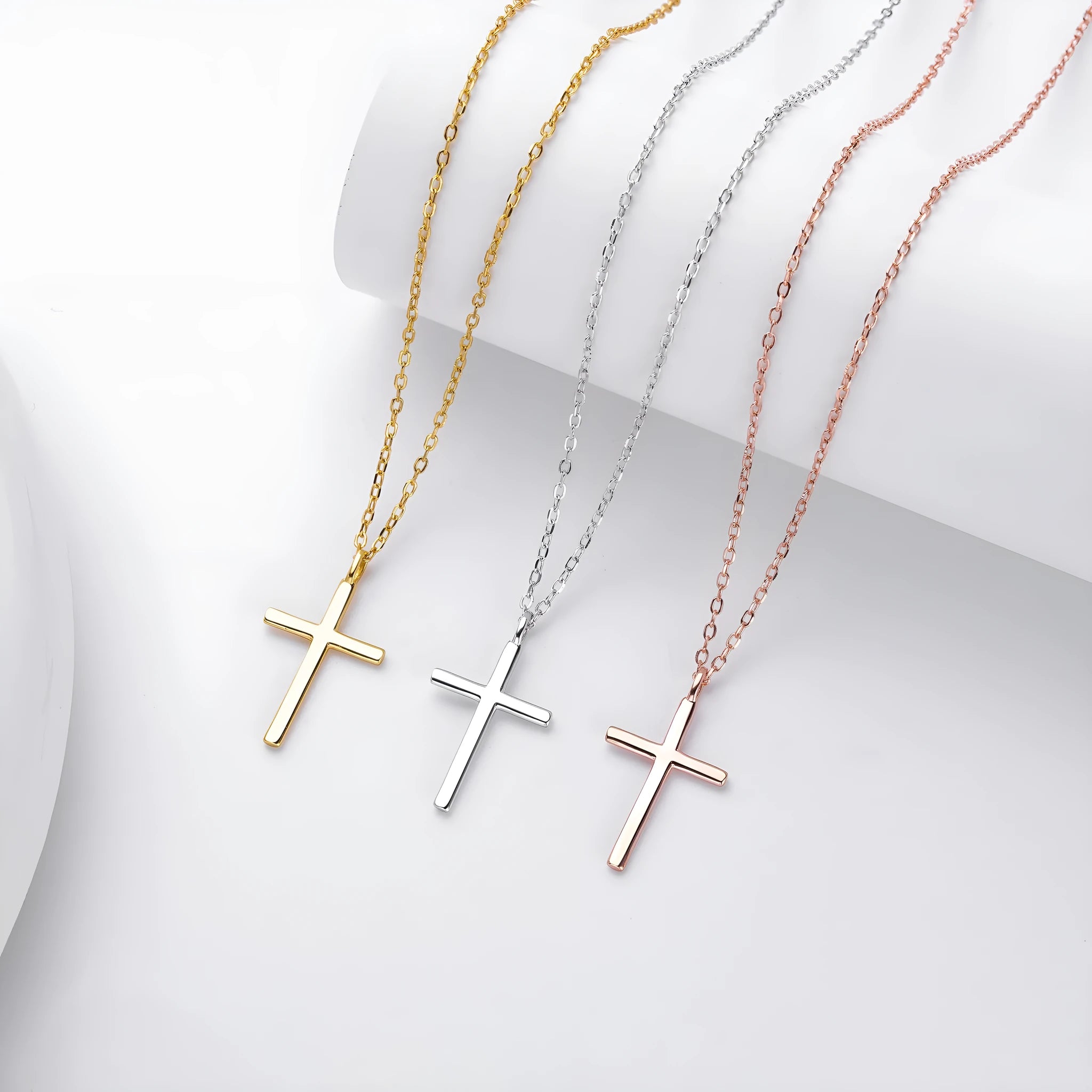 Sterling silver cross pendant necklace on an adjustable O-chain in gold, platinum, or rose gold plating.