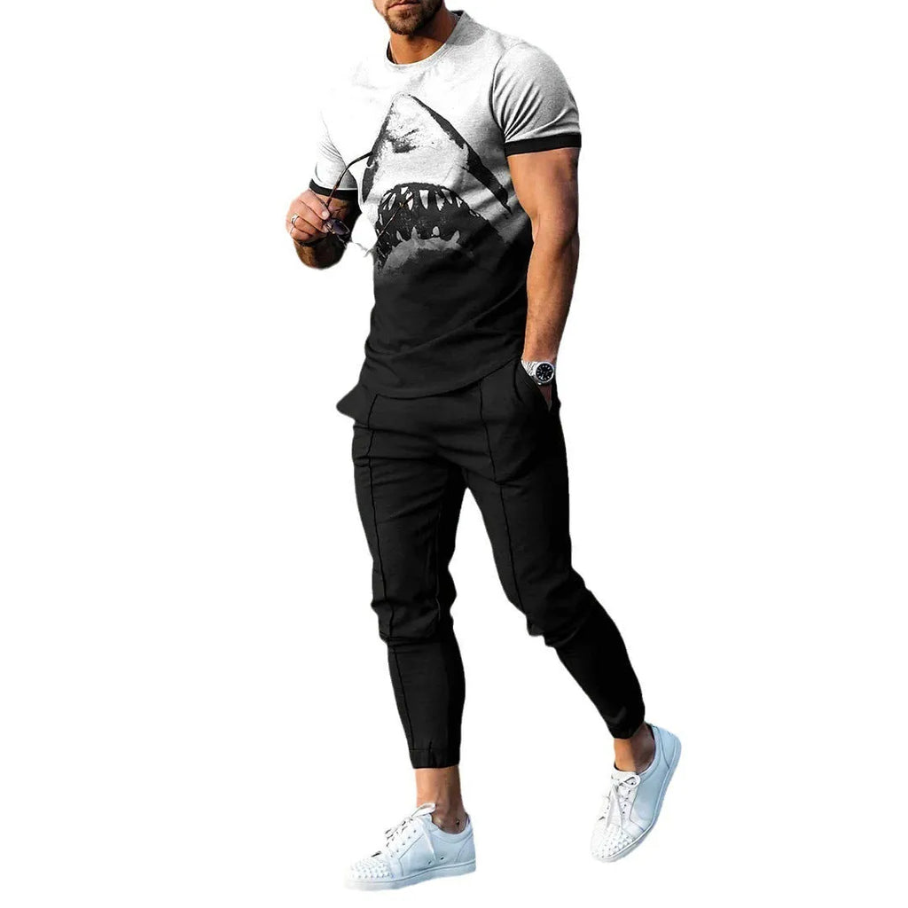Men's grey printed short-sleeved tracksuit top and trousers laid flat.