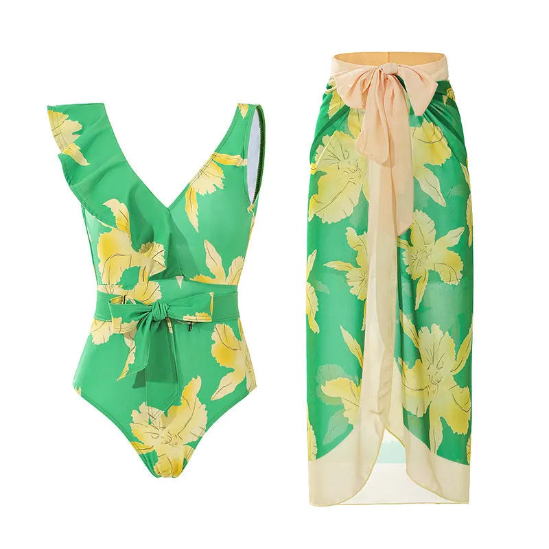 Women's solid colour one-piece swimsuit with thin spaghetti straps and a matching detachable skirt.