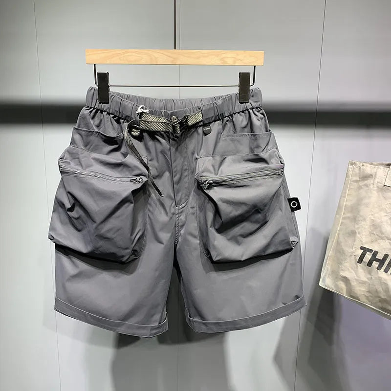 Men's loose fit black casual shorts with pockets and straight leg hem.