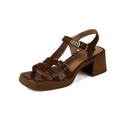 Black retro women's sandals with a T-shaped buckle, open square toe, and a chunky platform heel.