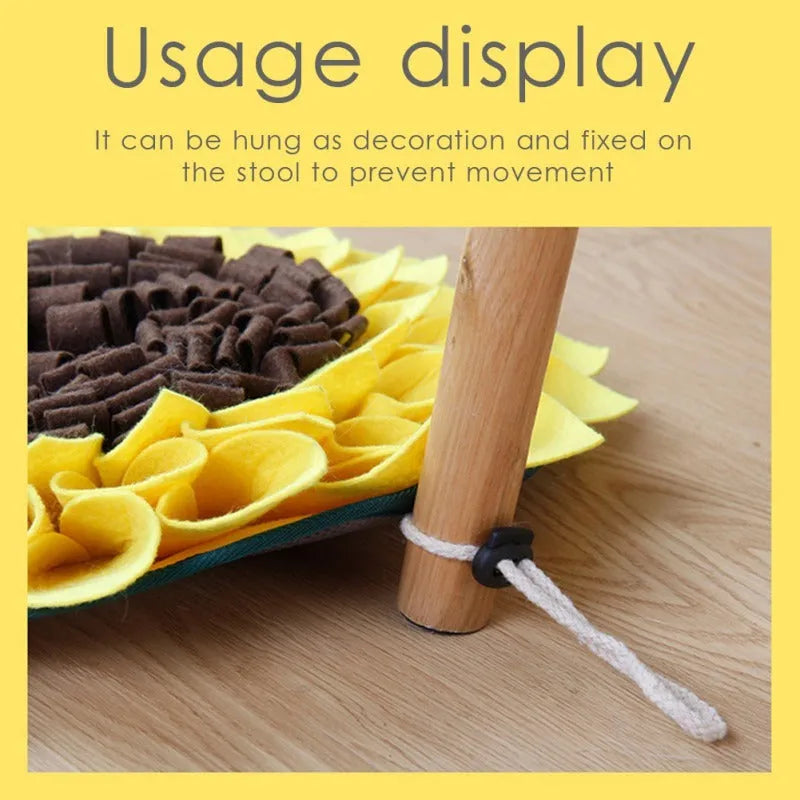 Yellow sunflower-shaped dog snuffle mat with fleece texture and a buckle strap for non-slip use.