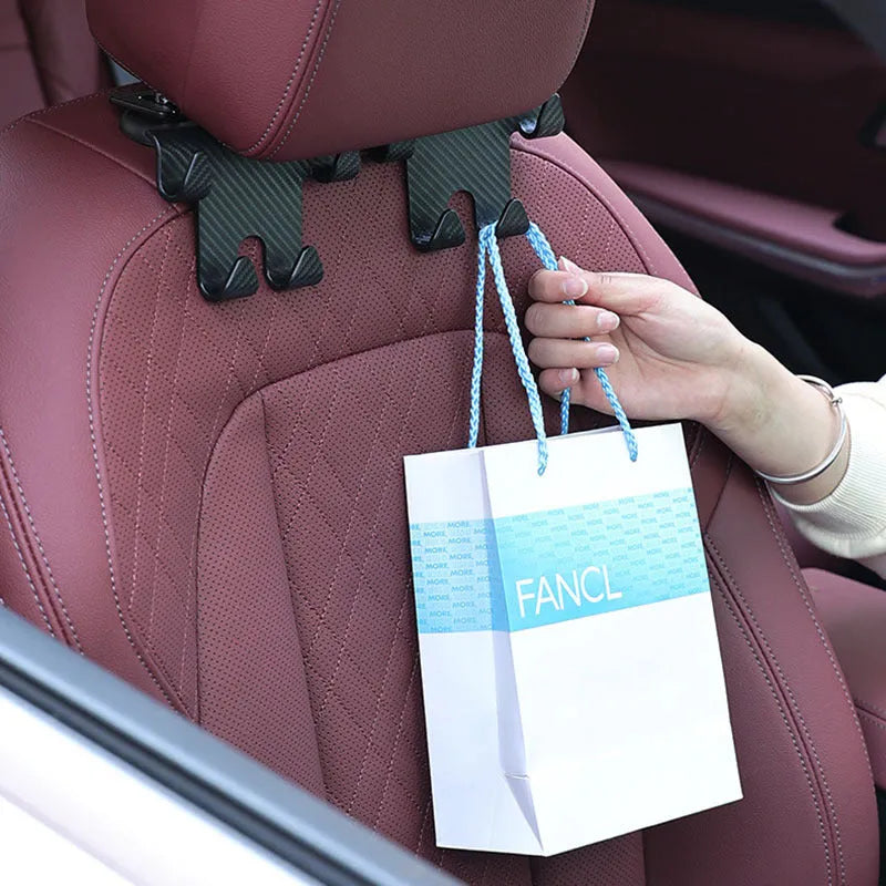Black ABS car hook and mobile phone bracket for rear seat back storage.
