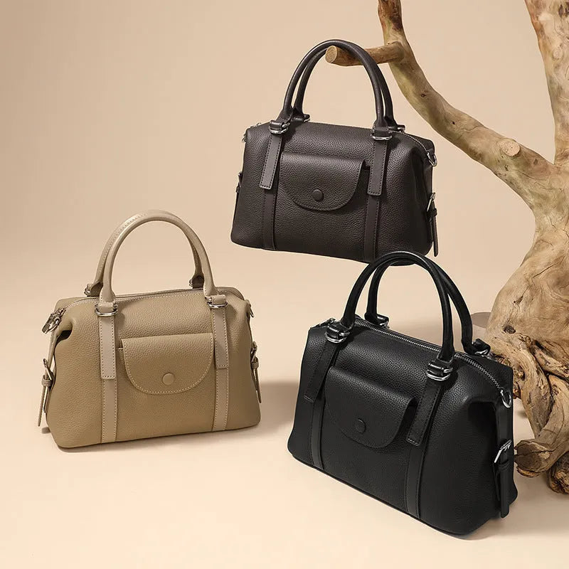Genuine leather women's handbag with lock closure and single shoulder strap in street trend style