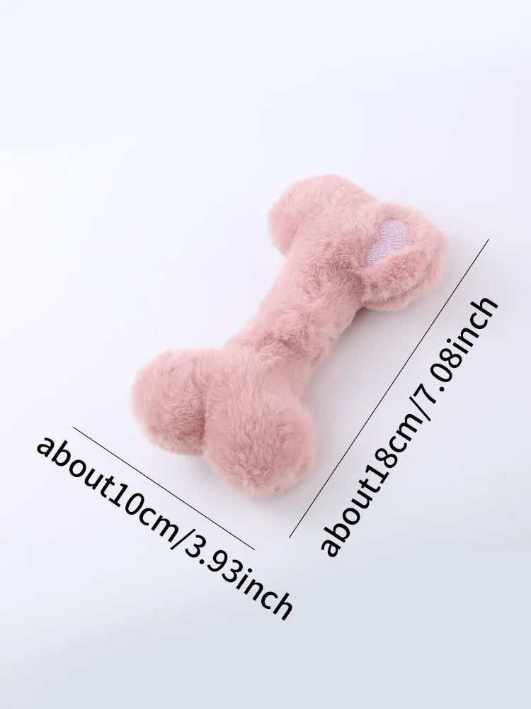 Blue plush bone-shaped dog toy with a squeaker, labelled Grinding Teeth, on a plain background