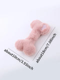 Blue plush bone-shaped dog toy with a squeaker, labelled Grinding Teeth, on a plain background