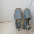 Women's canvas flat sandals with leather accents in retro fisherman style with animal print