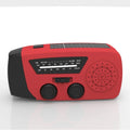 Red rechargeable emergency hand radio and torch with USB port, wrist strap, and display screen.