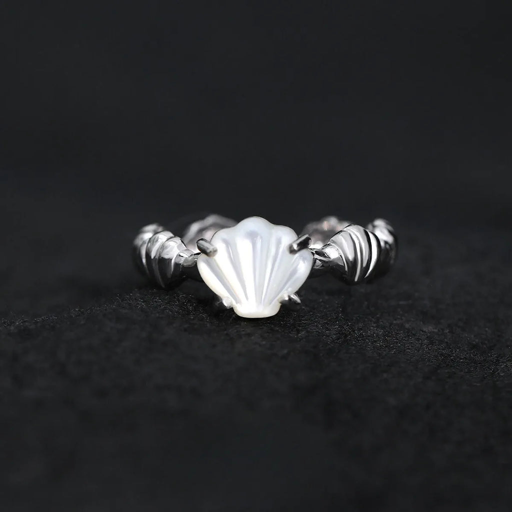 Adjustable silver ring with shell and tiger eye decoration in white gold or 18K gold electroplated finish.