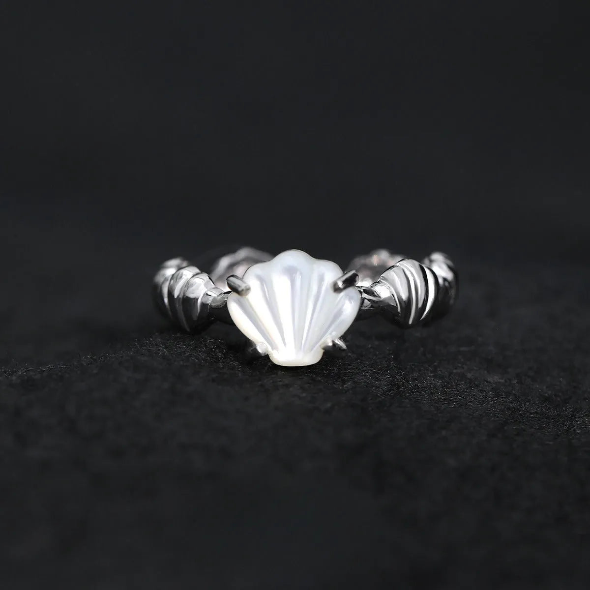 Adjustable silver ring with shell and tiger eye decoration in white gold or 18K gold electroplated finish.