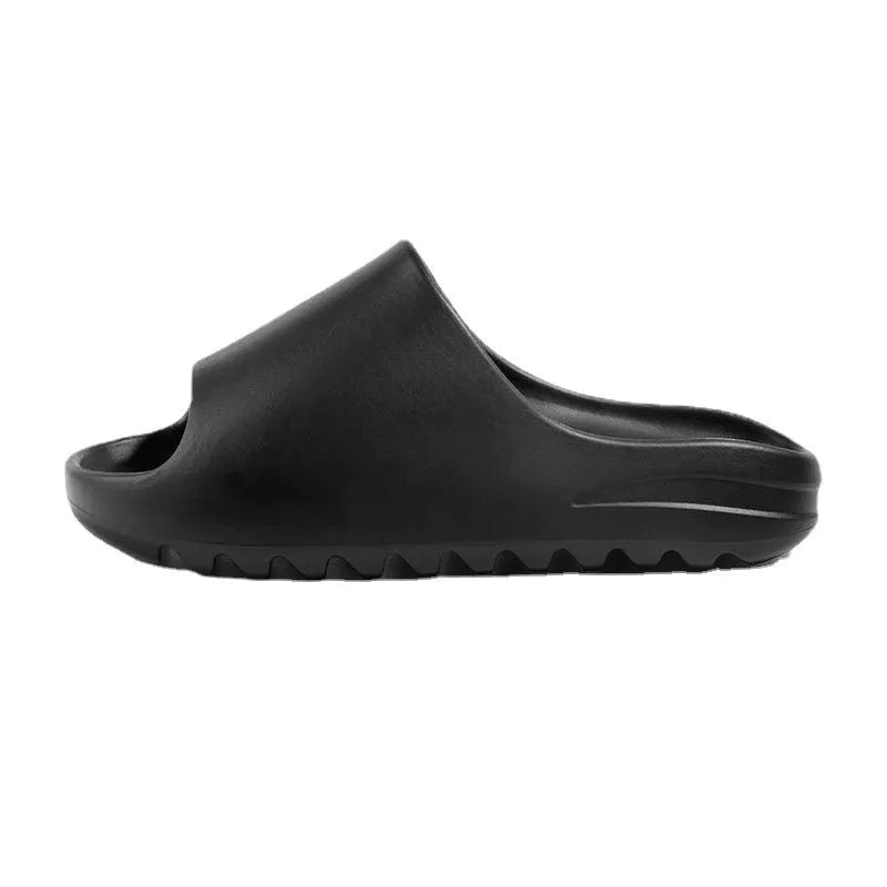 Women's thick-sole beach slippers in black, green, or brown on a sandy background.