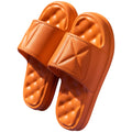 A pair of thick-soled EVA bathroom slippers in a chosen colour, showing the non-slip sole pattern.