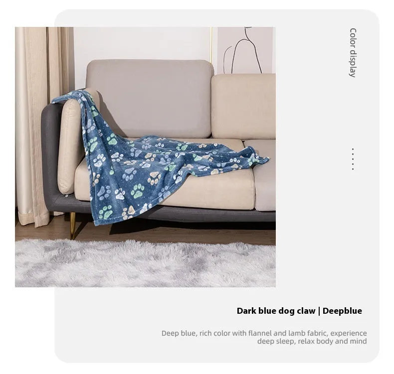 Blue cartoon dog pattern on a thick flannel pet blanket laid flat, showing its size as a dog kennel mat.