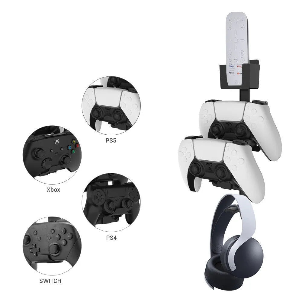 White wall-mounted plastic hook holding a PS5 controller and gaming headset.