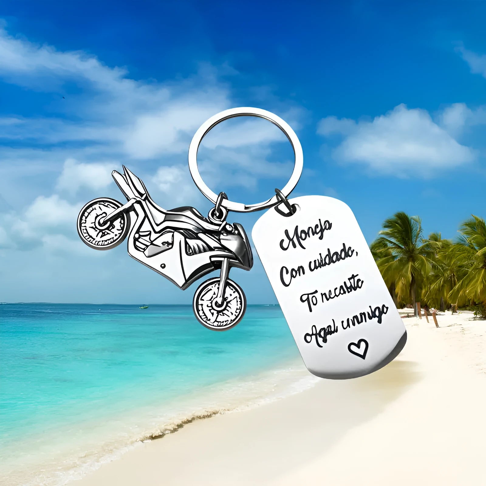 Stainless steel motorcycle key ring with modern design presented with a velvet pouch.