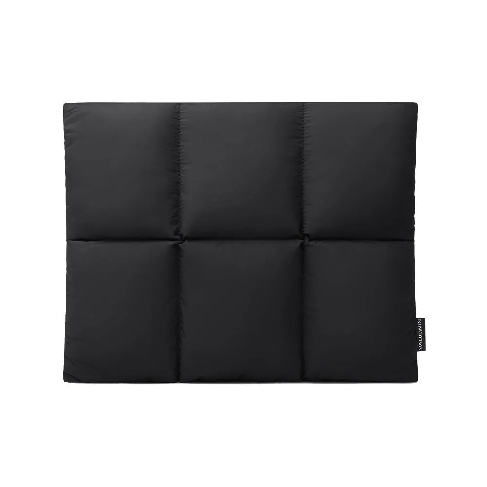 Soft fluffy black polyester laptop sleeve for a 15.6 inch laptop with visible stitching.
