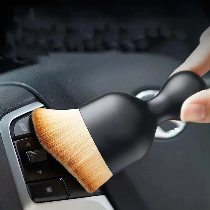 PVC soft brush for car interior dust removal, 10 cm long, in white, pink, or black colour.