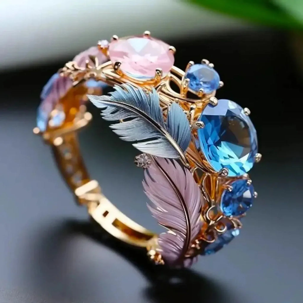 Gold colour brass ring with embossed colourful feather design and zircon stone inlay