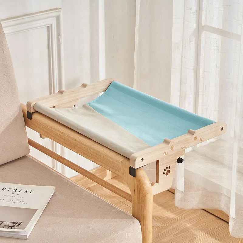 Wooden cat hanging bed hammock mounted on a balcony railing, one of seven available style variations.