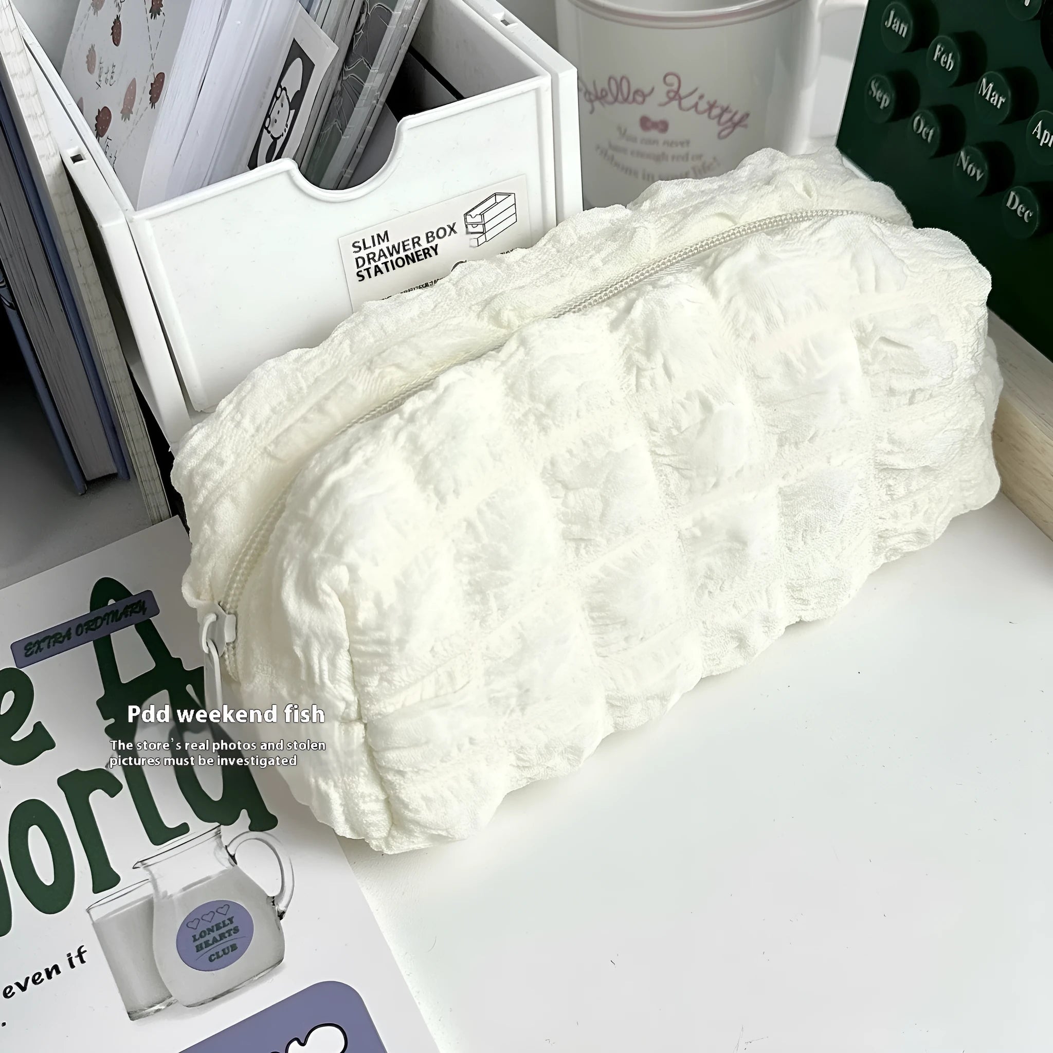 Cream puff design fabric pencil case in polyester material showing beige and black colour options