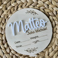 Square wooden baby name sign with engraved birth details including name, date, time, weight, and length.