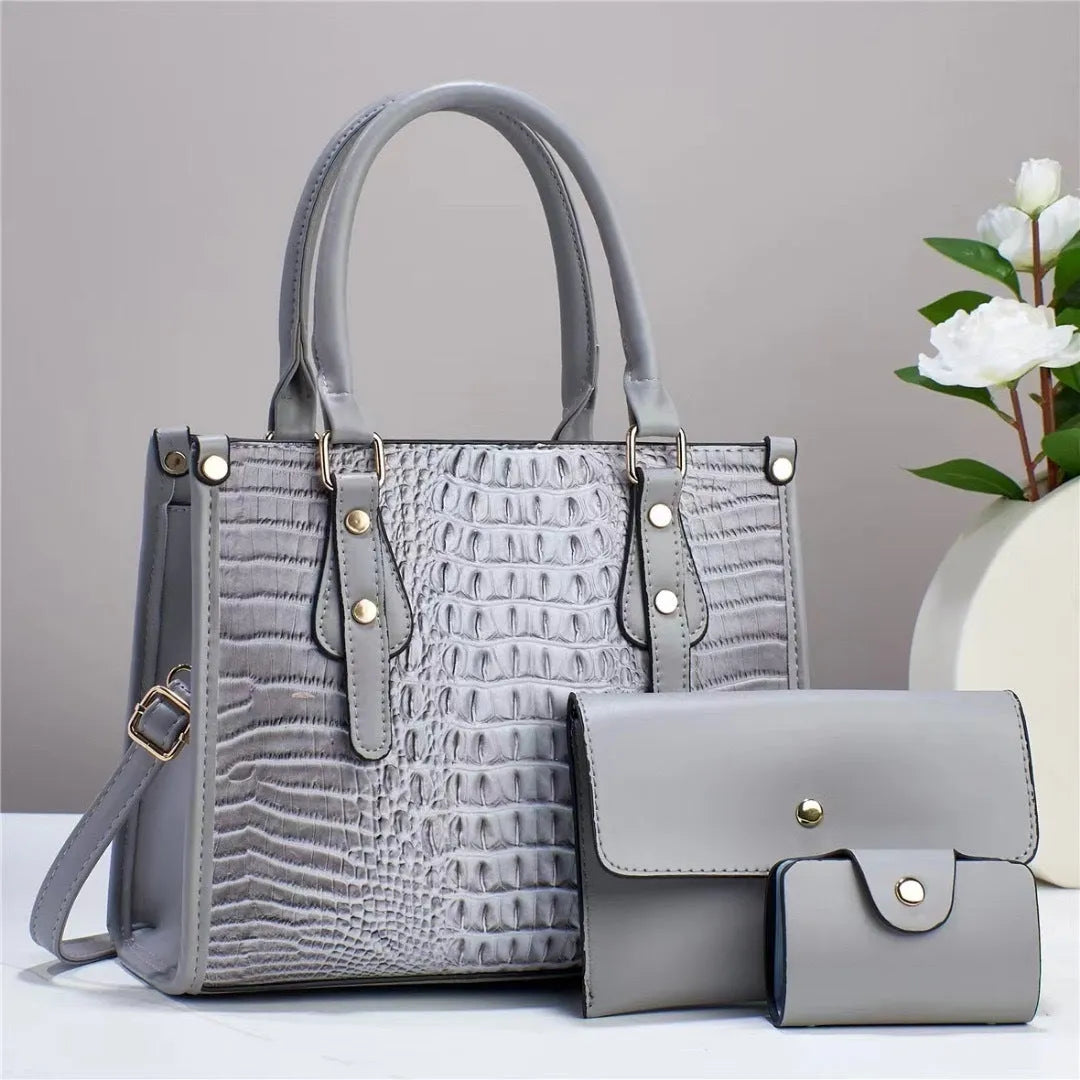 Women's contrast colour minimalist textured three-piece bag set showing crossbody bag, wallet and card holder in PU material
