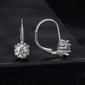 White gold plated sterling silver flower bud clip earrings with a moissanite centre stone