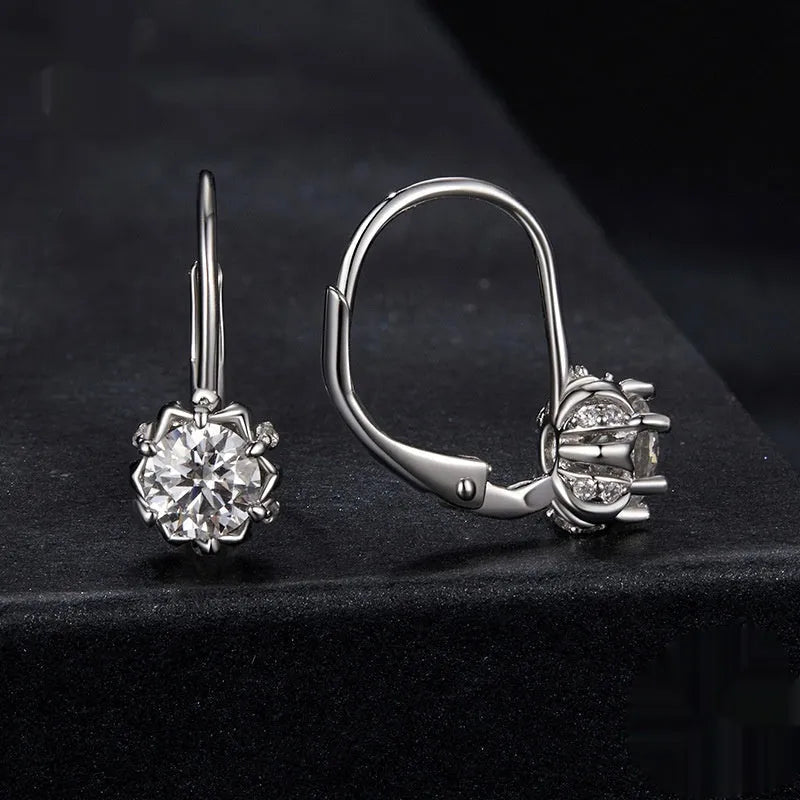 White gold plated sterling silver flower bud clip earrings with a moissanite centre stone