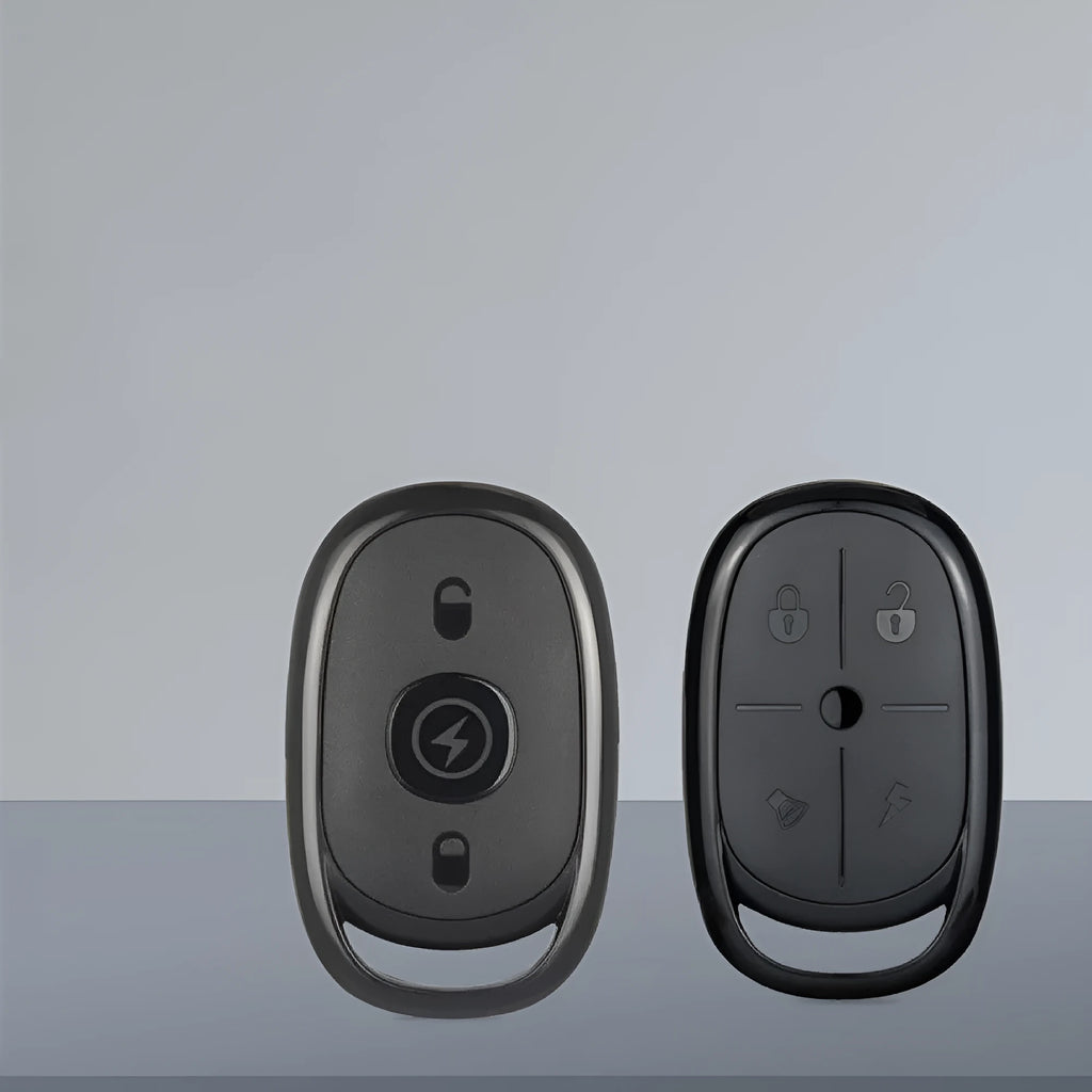 Compact ABS plastic 433MHz wireless car remote control duplicator on a keyring.