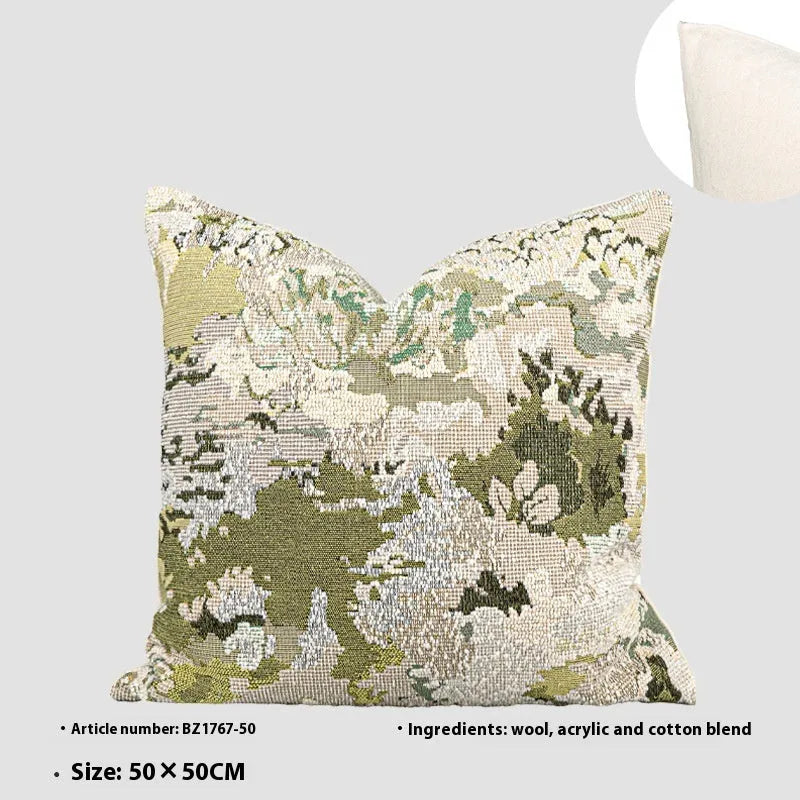 Antique green wool blend decorative pillow with abstract floral pattern, shown in lumbar and square sizes.