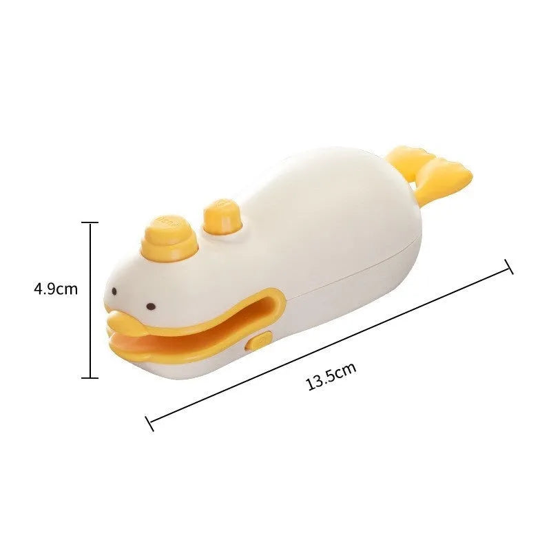 Yellow duck patterned rechargeable handheld vacuum food sealer with USB charging cable.
