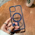 Clear acrylic MagSafe phone case for iPhone with magnetic ring visible through transparent back
