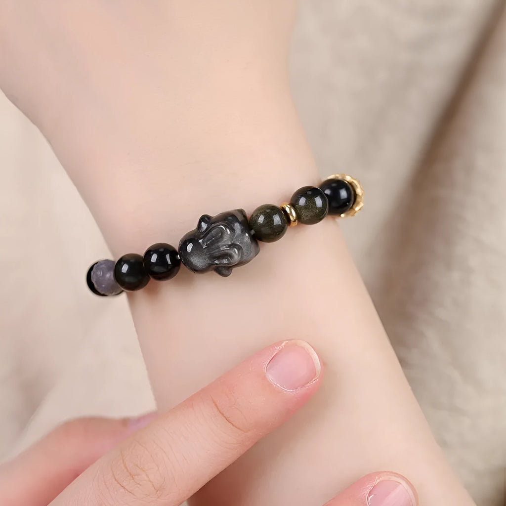 Handmade lying rabbit charm obsidian bracelet with grey agate beads in 8mm and 10mm sizes.