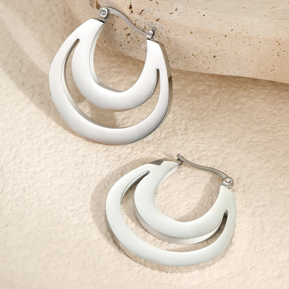 Geometric French earrings with stainless steel construction and 18K gold plating in minimalist design