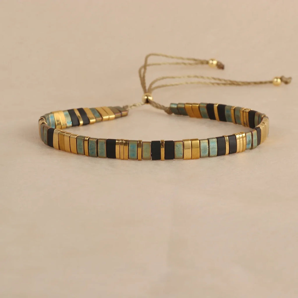 Geometric glass beaded bracelet in milky white, black, green, blue, or red with round elements
