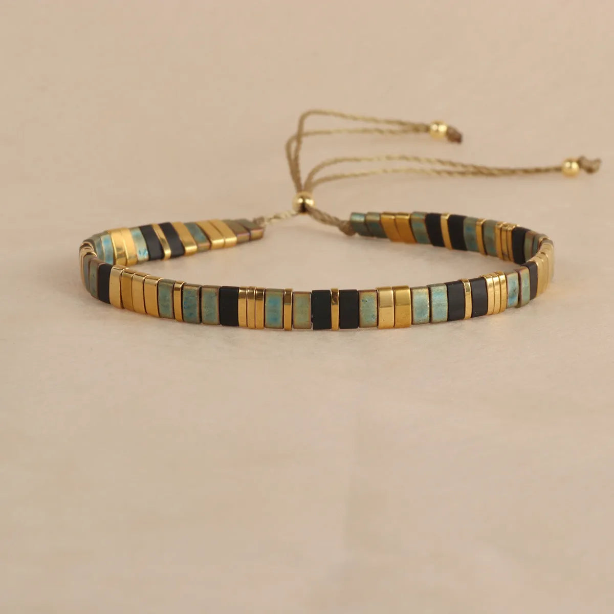 Geometric glass beaded bracelet in milky white, black, green, blue, or red with round elements