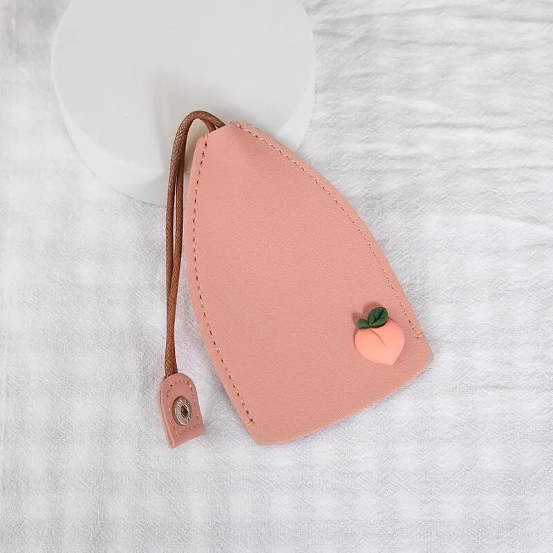 Colourful cartoon pull-out key case made from PU leather showing design options