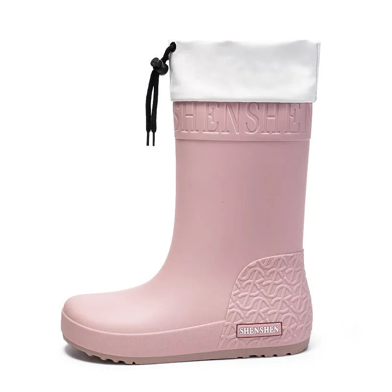 Women's solid colour PVC rain boots in apricot, shown with non-slip sole.