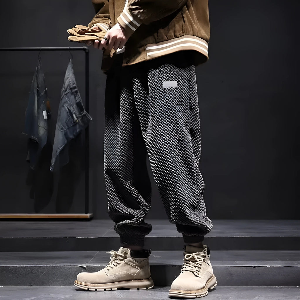 Men's grey casual sweatpants with an ankle tie and straight-leg fit.
