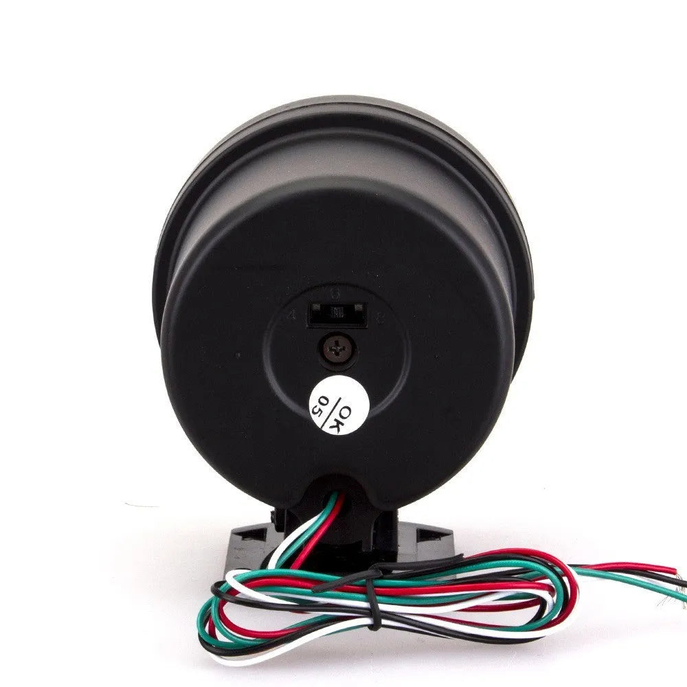 Black automotive tachometer with blue-lit dial showing RPM scale up to 8000