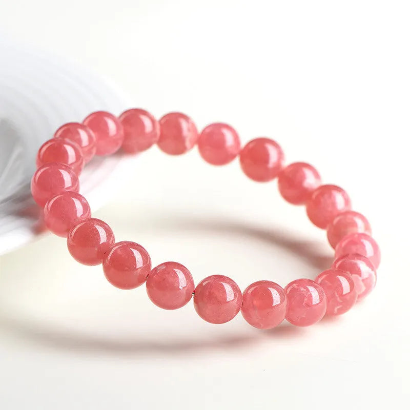 Women's geometric crystal bracelet with Longevity Lock in natural red rhodochrosite stone.