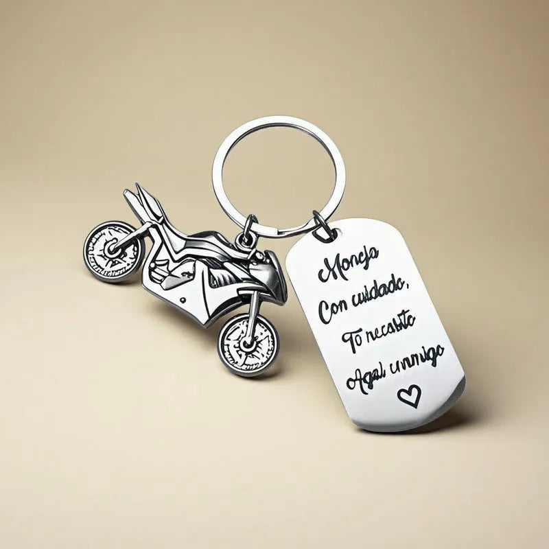 Stainless steel motorcycle key ring with modern design presented with a velvet pouch.