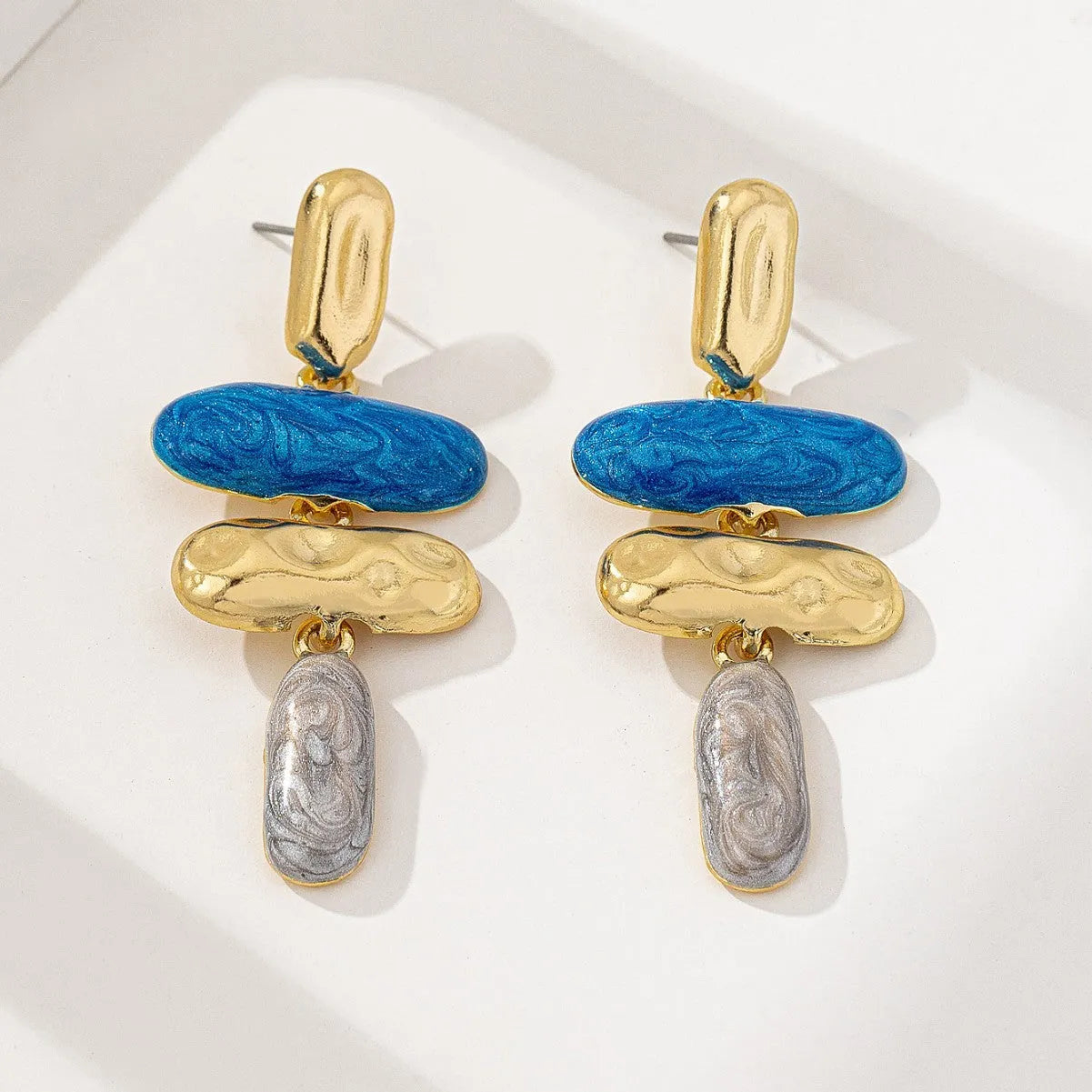 Geometric stud earrings with multicolour electroplated finish on zinc alloy