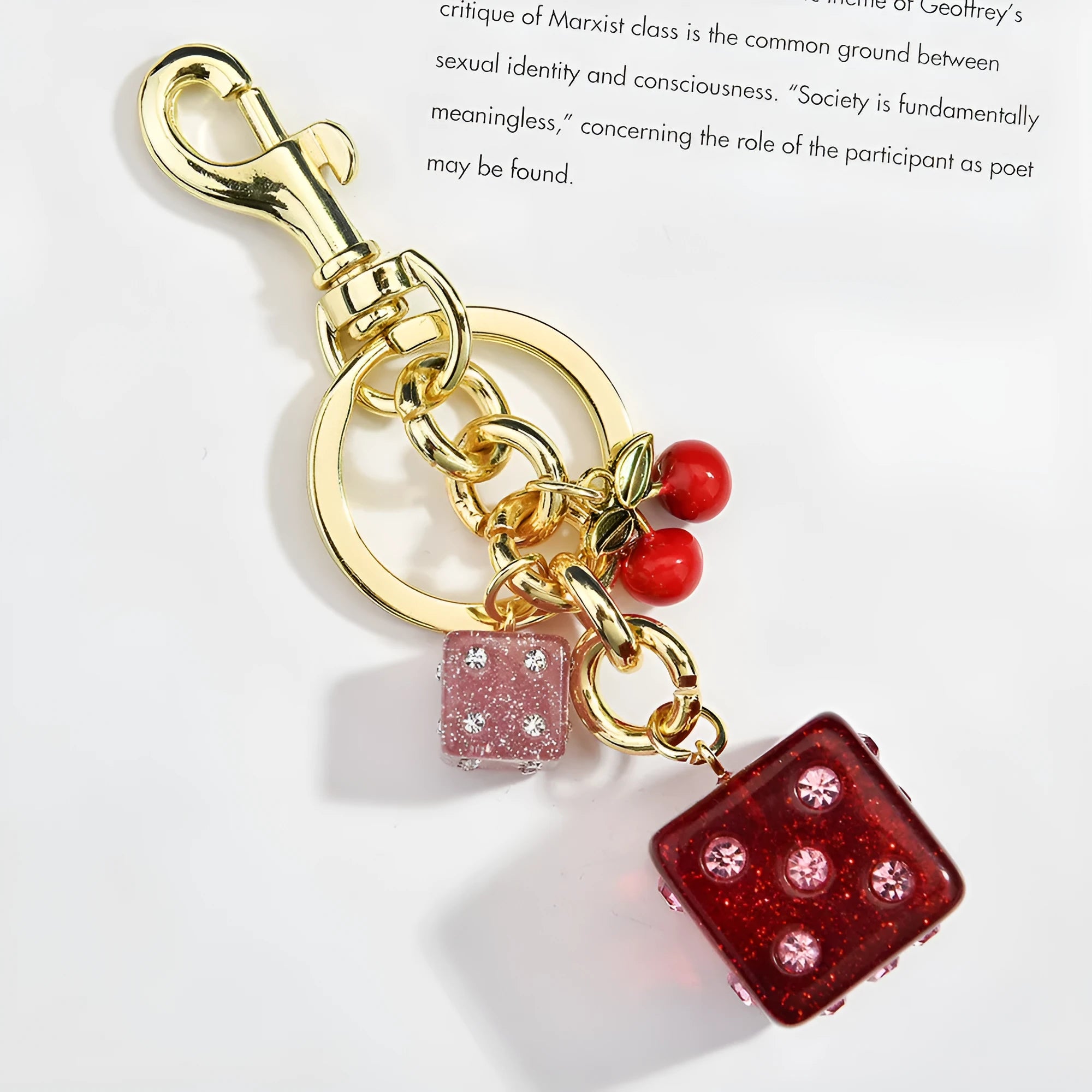 Square metal keychain pendant with a vintage cherry two-colour dice design.