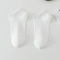 Men's solid colour polyester boat socks showing low-cut ankle design in various colour options