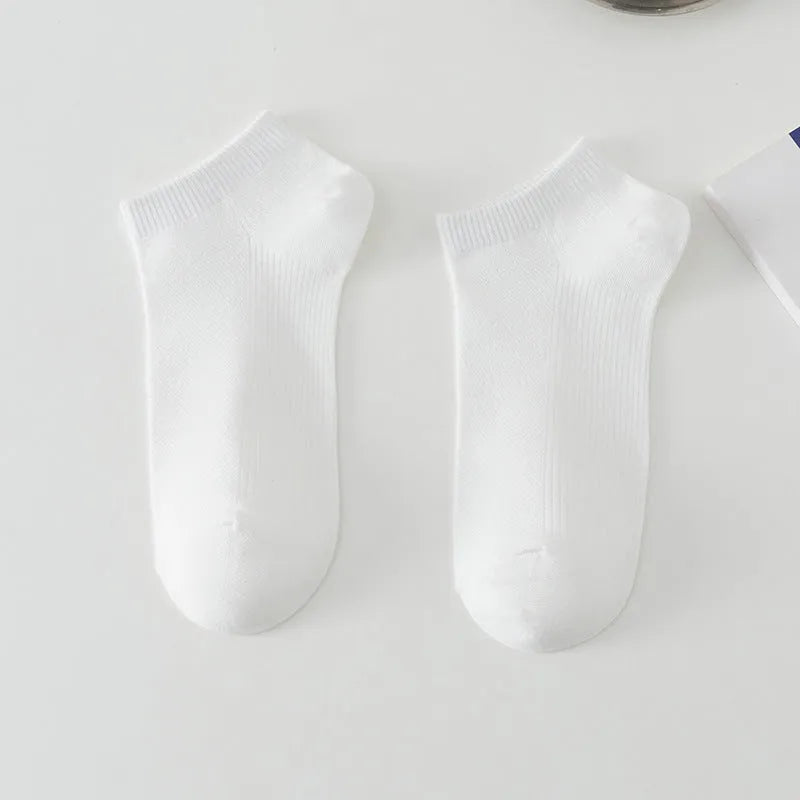 Men's solid colour polyester boat socks showing low-cut ankle design in various colour options
