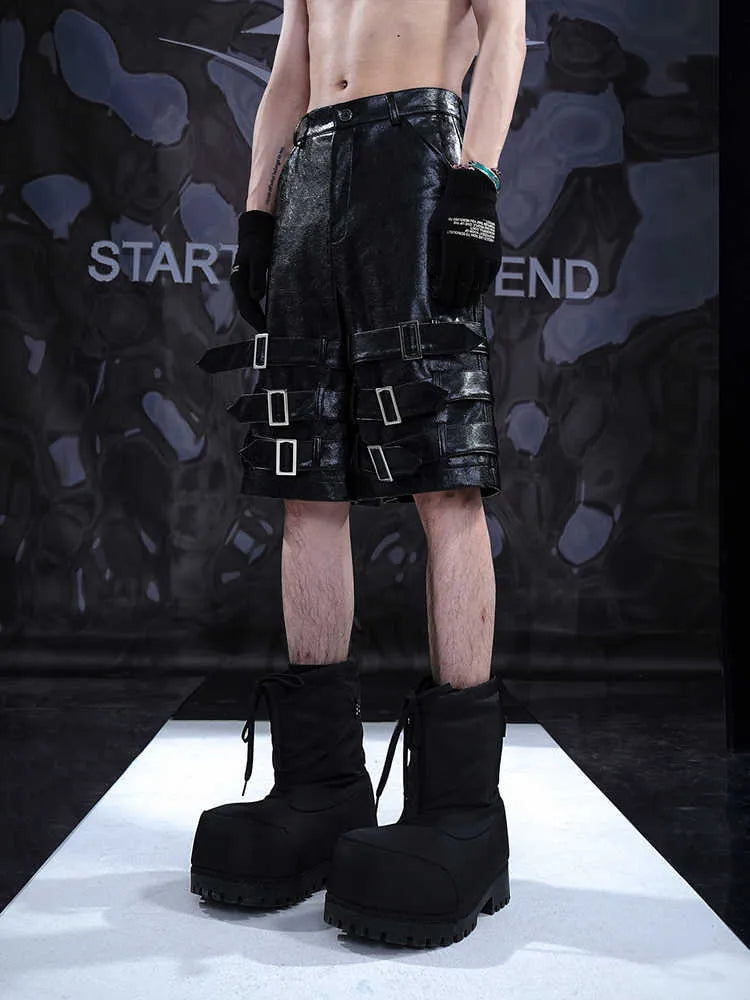 Men's black PU leather cropped shorts with medium-low waist design on hanger
