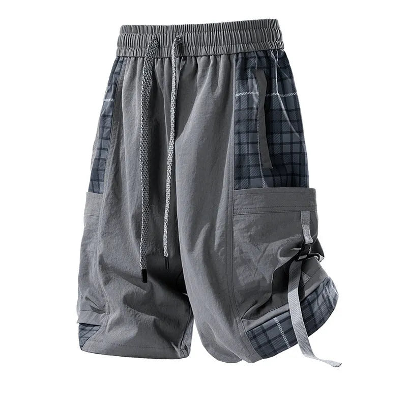 Man wearing loose-fit beige cargo shorts with visible plaid stitching detail on the legs.