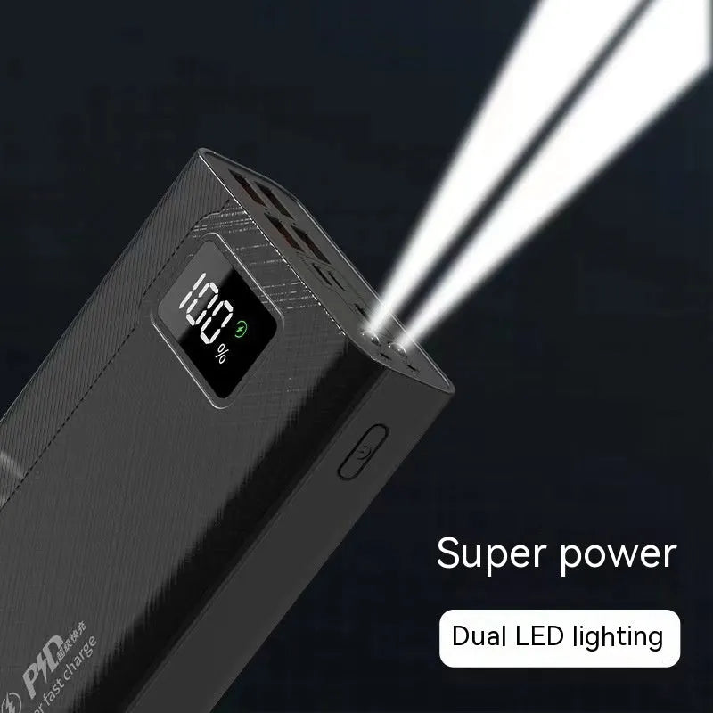 Black and white large capacity power bank with fast charging, showing size comparison