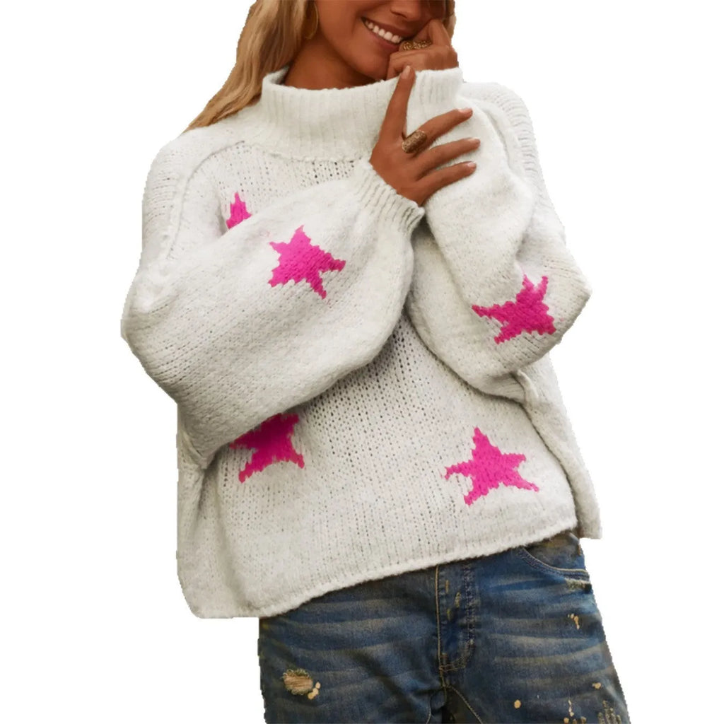 White women's loose turtleneck pullover sweater with a black five-pointed star pattern on the front.